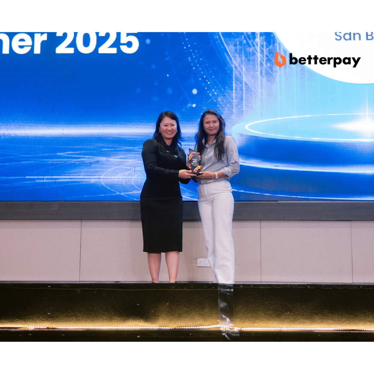BetterPay receiving Emerging Excellence Partner 2025 award from Fiuu